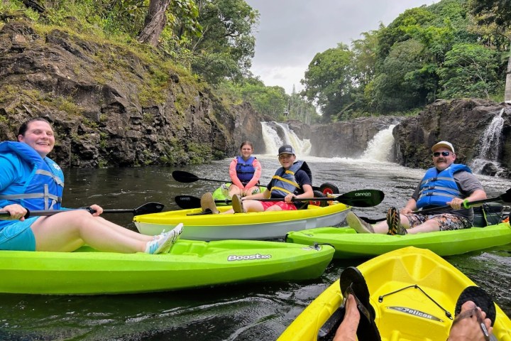 a group of people sitting on a raft