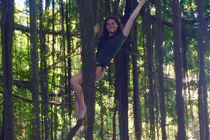 a man standing in a wooded area