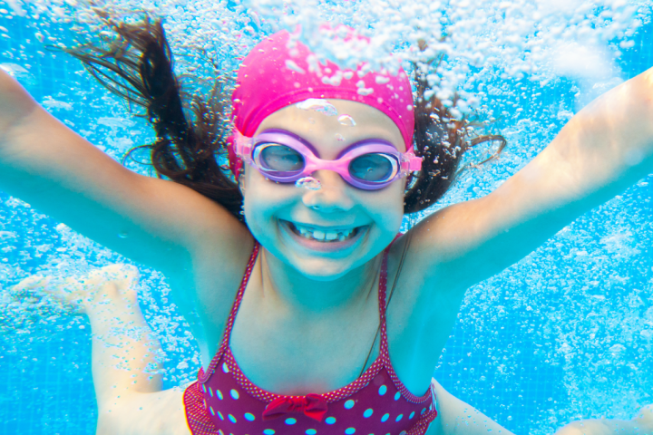 a girl in a pool of water