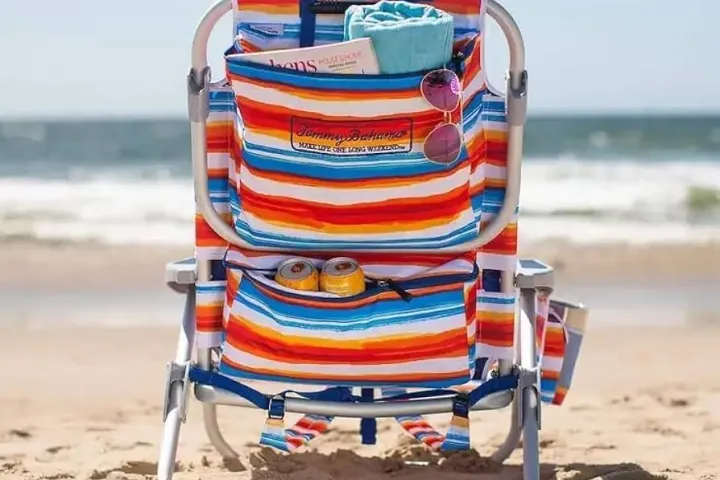 a boat sitting on top of a sandy beach