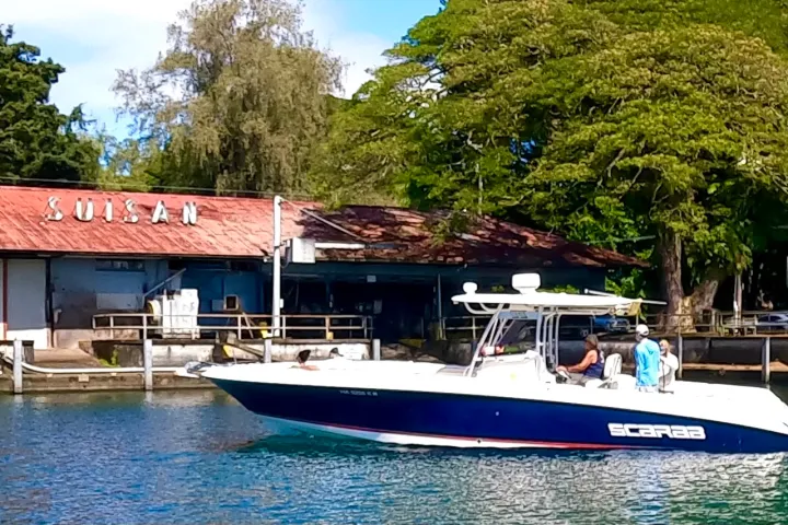 a boat is docked next to a body of water