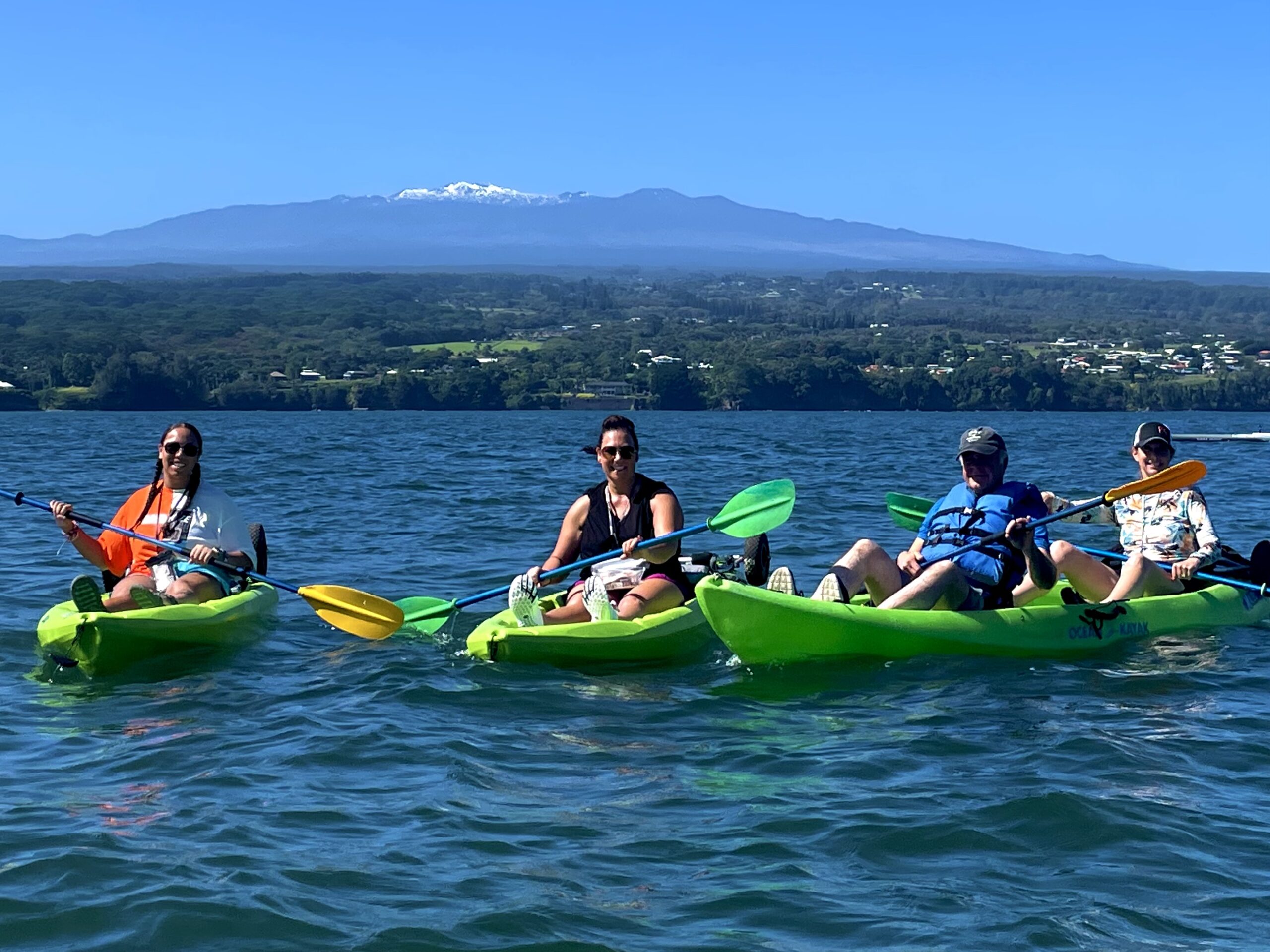 Kayakers on Hilo Bay with Mauna Kea in the background
