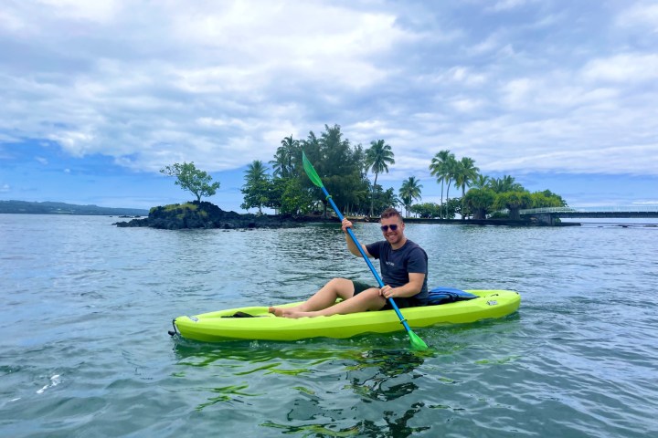 a person riding a surf board on a body of water