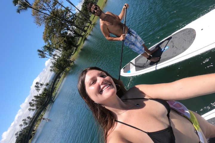 a person riding on the back of a boat