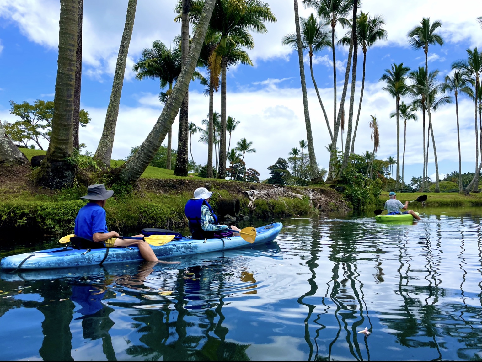 Kayakers paddling down the Wailoa River in Hilo