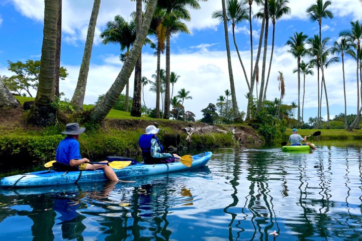 a group of people on a boat in the water