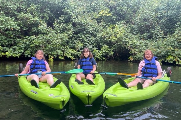 a group of people riding on the back of a boat
