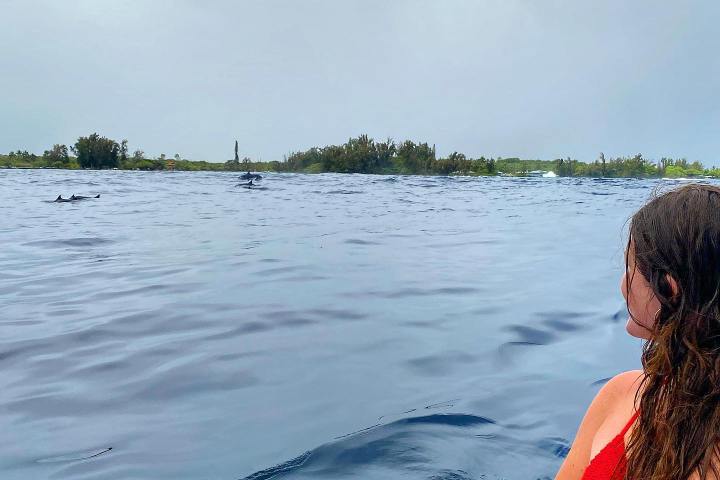 a person standing next to a body of water