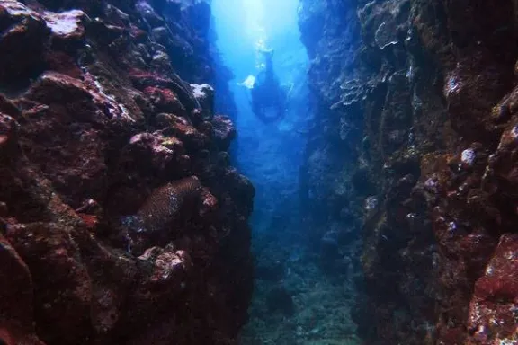 underwater view of a large rock