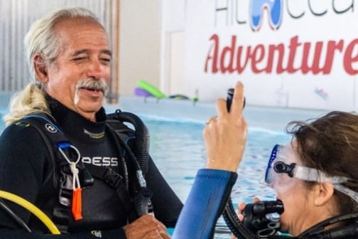 a man and a woman looking at the camera