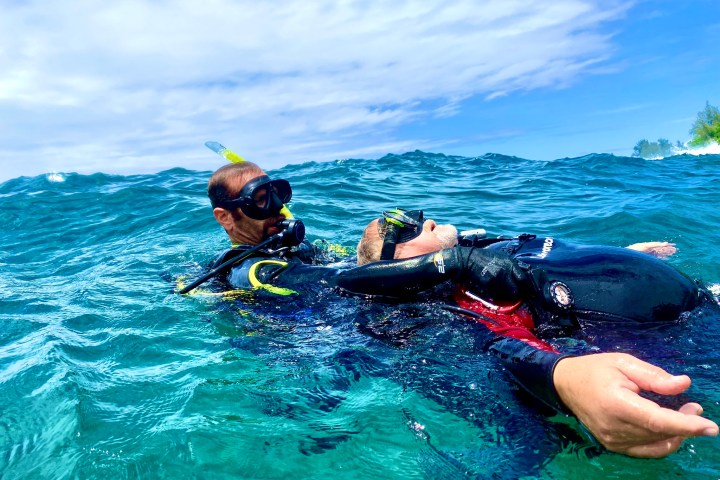 a person riding a surf board on a body of water