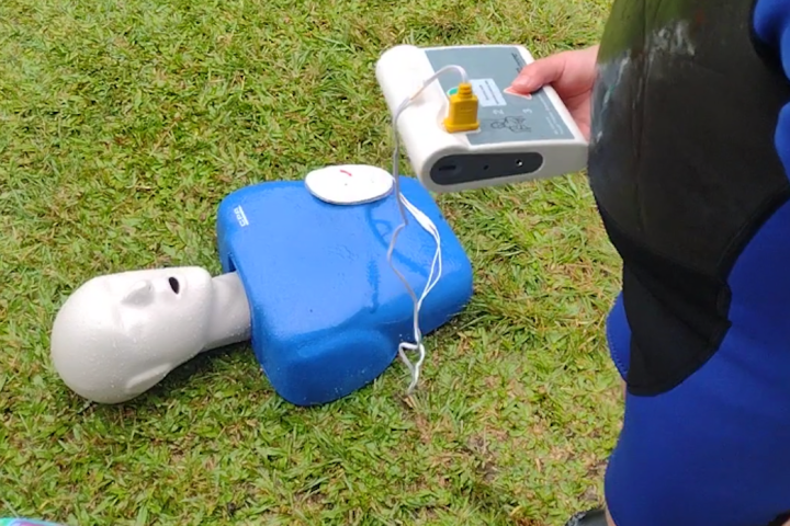 a little boy that is standing in the grass