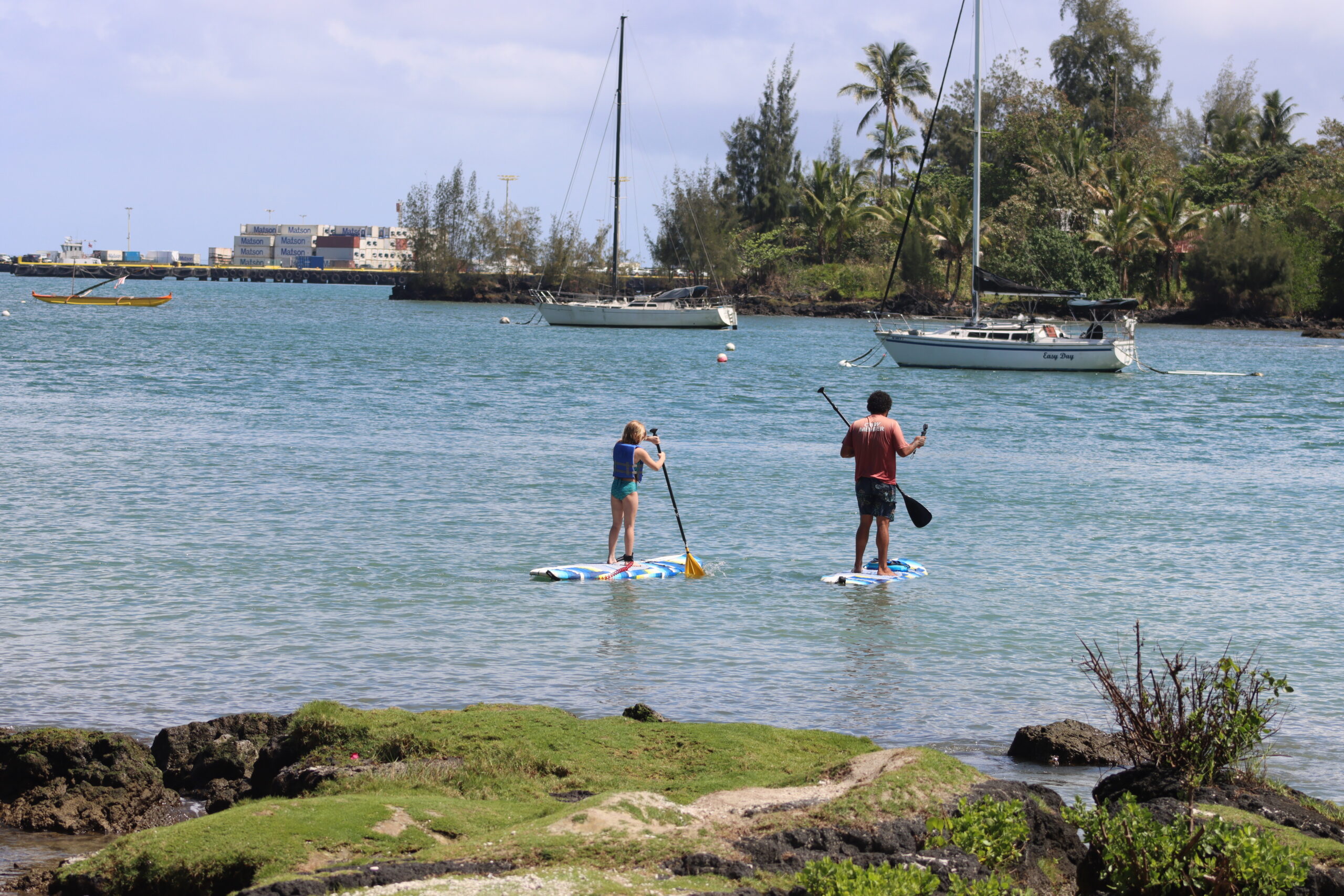 Student and instructor on paddleboards in Reeds Bay