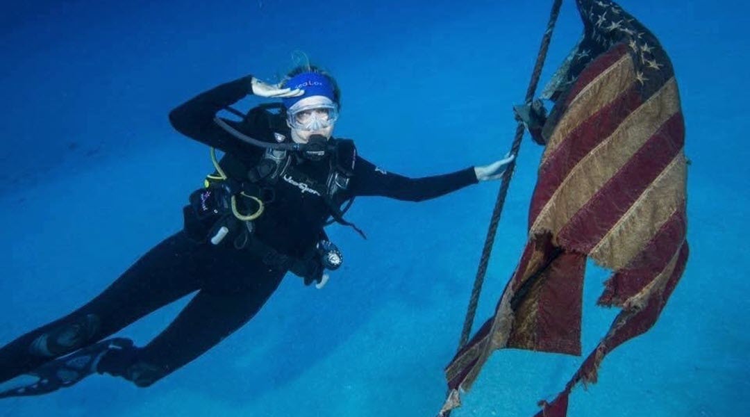 Scuba Diver With A Flag