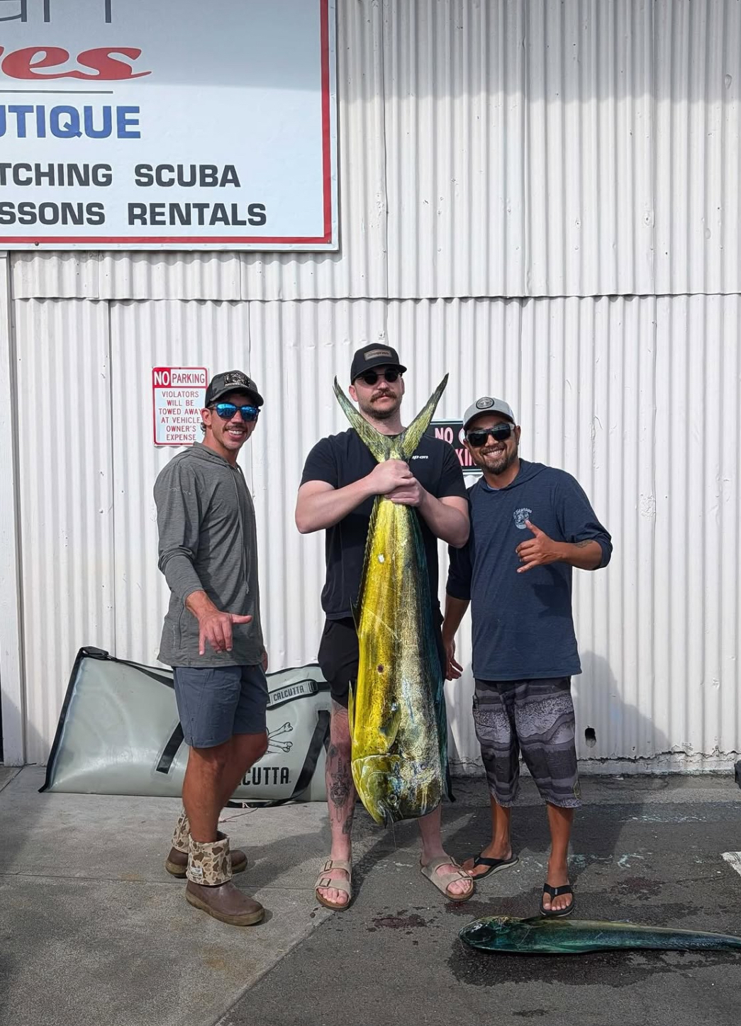 Anglers with a large mahimahi caught off Hilo, Hawaii
